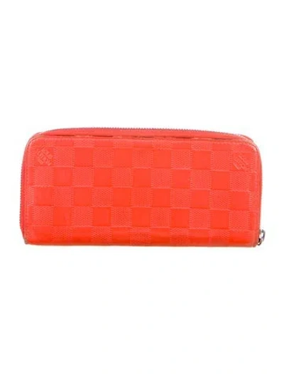 Pre-owned Louis Vuitton 2015 Damier Infini Zippy Wallet In Orange