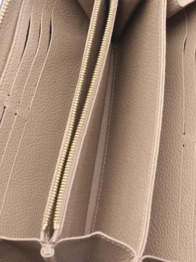 Pre-owned Louis Vuitton 2016-2025 Monogram Empreinte Zippy Wallet Long Wallets In Brown