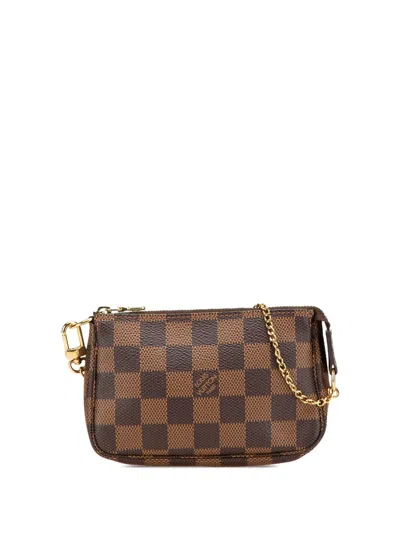 Pre-owned Louis Vuitton 2016 Damier Ebene Mini Pochette Accessoires Handbag In Brown