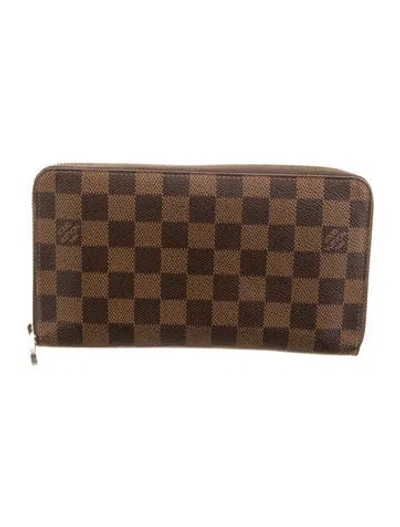 Pre-owned Louis Vuitton 2016 Damier Ebene Pattern Zippy Wallet In Brown