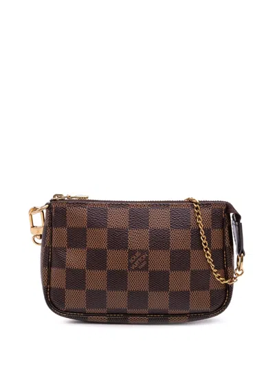 Pre-owned Louis Vuitton 2017 Damier Ebene Mini Pochette Accessoires Handbag In Brown