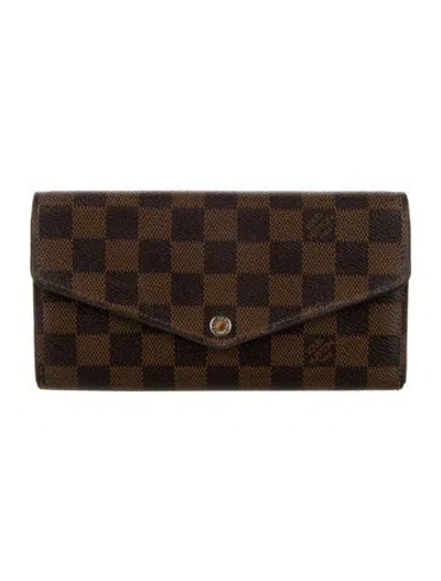 Pre-owned Louis Vuitton 2017 Damier Ebene Pattern Sarah Wallet In Brown