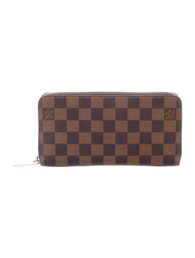 Pre-owned Louis Vuitton 2017 Damier Ebene Pattern Zippy Wallet In Brown