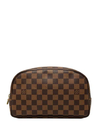 Pre-owned Louis Vuitton 2017 Damier Ebene Trousse Toilette 25 Clutch Bag In Brown