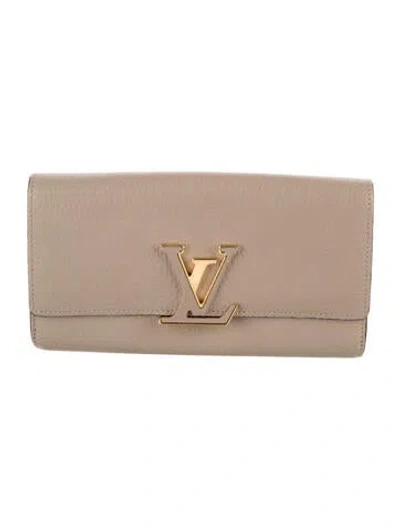 Pre-owned Louis Vuitton 2019 Taiga Leather Capucines Wallet In Neutral