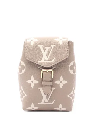 Pre-owned Louis Vuitton 2021-2025 Bicolor Monogram Empreinte Giant Tiny Backpack In Brown