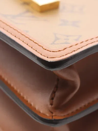 Pre-owned Louis Vuitton 2021 Monogram Reverse Mini Dauphine Satchel In Brown