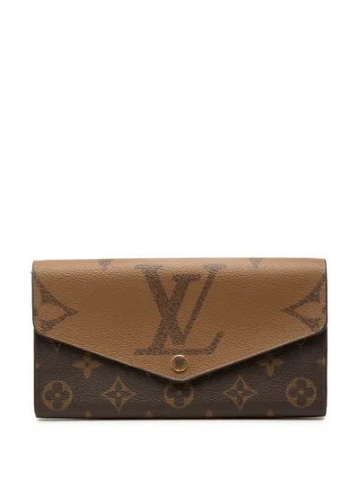 Pre-owned Louis Vuitton 2021-2026 Monogram Reverse Giant Sarah Wallet Long Wallets In Brown