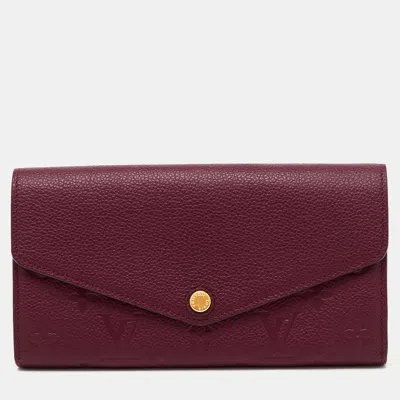 Pre-owned Louis Vuitton Aurore Monogram Empreinte Leather Sarah Wallet In Red