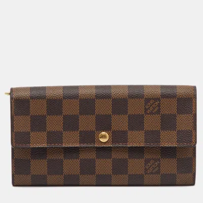 Pre-owned Louis Vuitton Damier Ebene Canvas Sarah Long Wallet In Brown