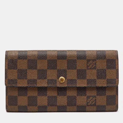 Pre-owned Louis Vuitton Damier Ebene Canvas Sarah Long Wallet In Brown