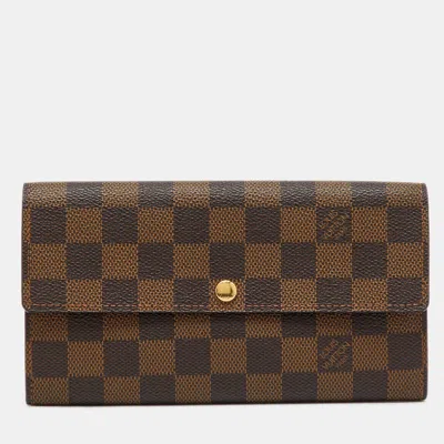 Pre-owned Louis Vuitton Damier Ebene Canvas Sarah Long Wallet In Brown