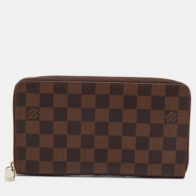 Pre-owned Louis Vuitton Damier Ebene Canvas Zippy Organizer Wallet In Brown