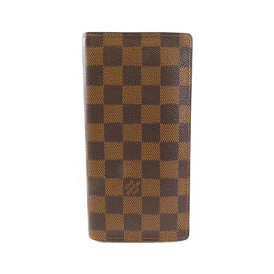 Pre-owned Louis Vuitton Damier Ebene Coated Canvas Long Wallet (bi-fold) () In Brown