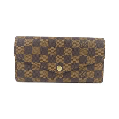 Pre-owned Louis Vuitton Damier Ebene Coated Canvas Long Wallet (bi-fold) () In Brown