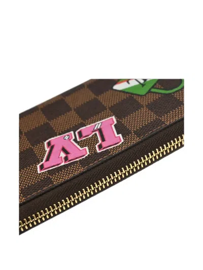 Pre-owned Louis Vuitton Damier Ebene Lv Stories Wallet In Brown