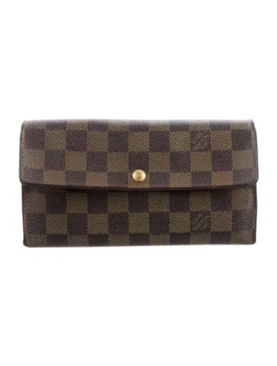 Pre-owned Louis Vuitton Damier Ebene Pattern Coated Canvas Sarah Wallet In Brown