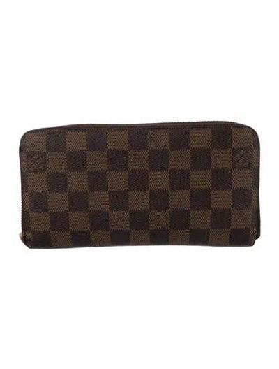Pre-owned Louis Vuitton Damier Ebene Pattern Coated Canvas Zippy Wallet In Brown