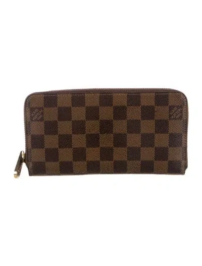 Pre-owned Louis Vuitton Damier Ebene Pattern Coated Canvas Zippy Wallet In Brown