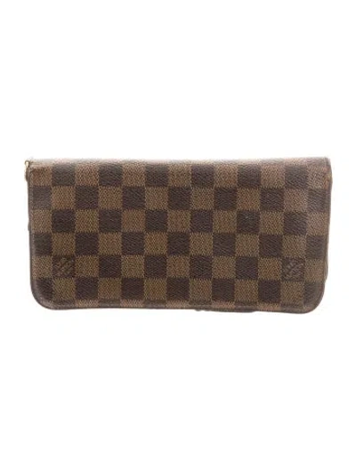 Pre-owned Louis Vuitton Damier Ebene Pattern Coated Canvas Zippy Wallet In Brown