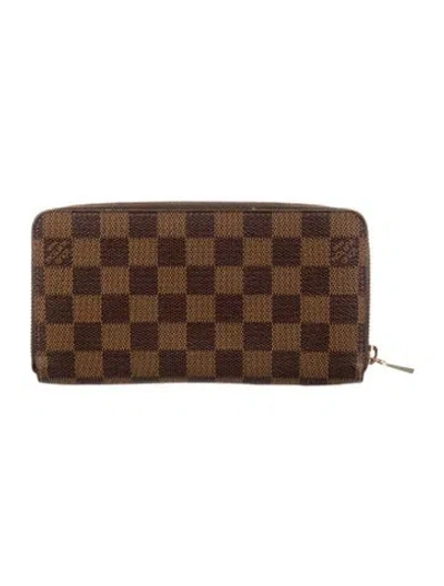 Pre-owned Louis Vuitton Damier Ebene Pattern Coated Canvas Zippy Wallet In Brown