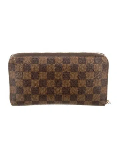 Pre-owned Louis Vuitton Damier Ebene Pattern Coated Canvas Zippy Wallet In Brown