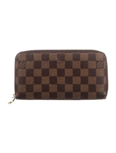 Pre-owned Louis Vuitton Damier Ebene Pattern Coated Canvas Zippy Wallet In Brown