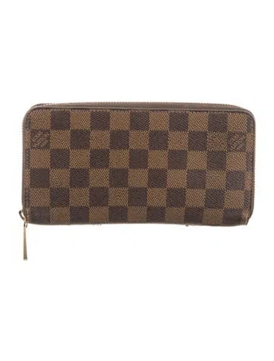 Pre-owned Louis Vuitton Damier Ebene Pattern Coated Canvas Zippy Wallet In Brown