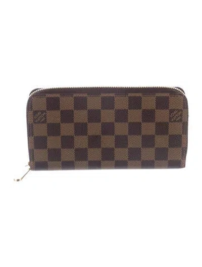 Pre-owned Louis Vuitton Damier Ebene Pattern Coated Canvas Zippy Wallet In Brown