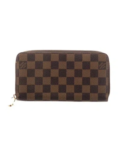 Pre-owned Louis Vuitton Damier Ebene Pattern Coated Canvas Zippy Wallet In Brown