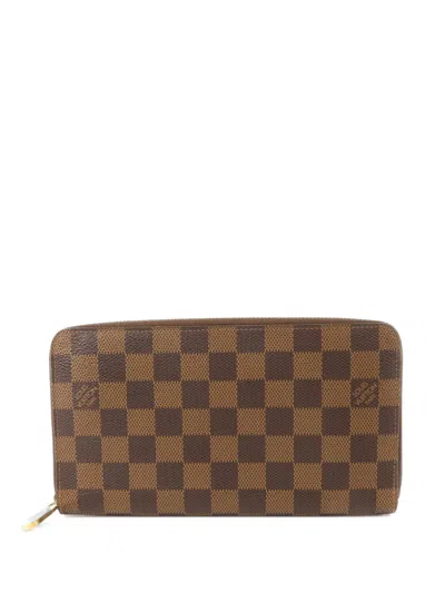 Pre-owned Louis Vuitton Damier Ebene Zippy Long Wallet In Brown
