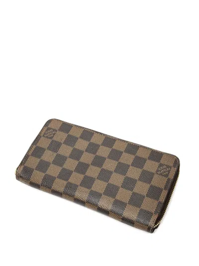 Pre-owned Louis Vuitton Damier Ebène Zippy Wallet In Brown