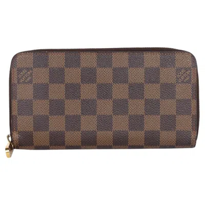 Pre-owned Louis Vuitton Damier Ebene Zippy Wallet Pvc Circa 2010, Good Condition In Gray