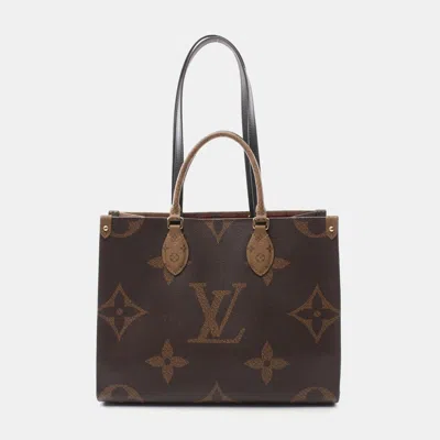 Pre-owned Louis Vuitton Monogram Giant Reverse On The Go Mm Tote Bag