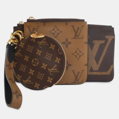 Pre-owned Louis Vuitton Monogram Reverse Giant Trio Pouch In Brown