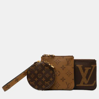 Pre-owned Louis Vuitton Monogram Reverse Giant Trio Pouch In Brown