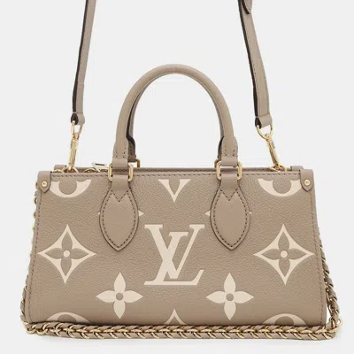 Pre-owned Louis Vuitton On The Go East West Monogram Empreinte Leather Tote Bag In Sand