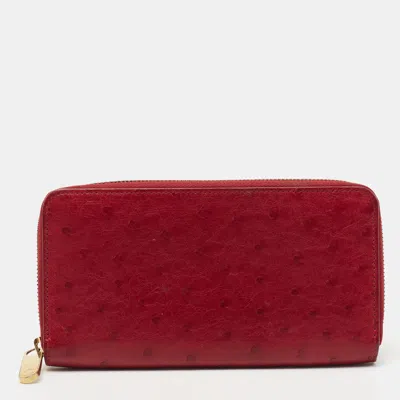 Pre-owned Louis Vuitton Red Ostrich Zippy Wallet