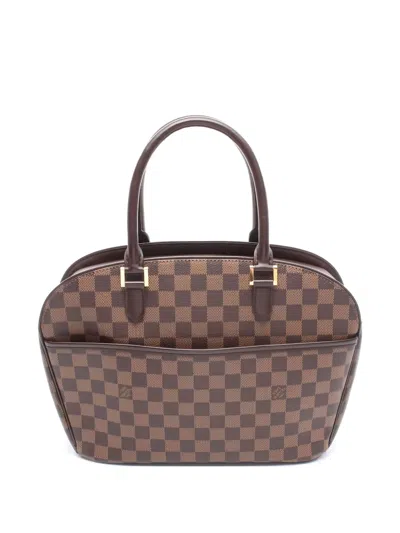 Pre-owned Louis Vuitton Saria Handbag In Brown