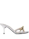 Love Moschino Laminated High-heeled Mules Sleek Bow In Silver