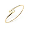Lucy Quartermaine Cross Open Drop Bangle In Gold
