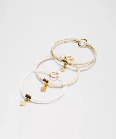 Lululemon Logo Charm Hair Ties 3 Pack In Gold