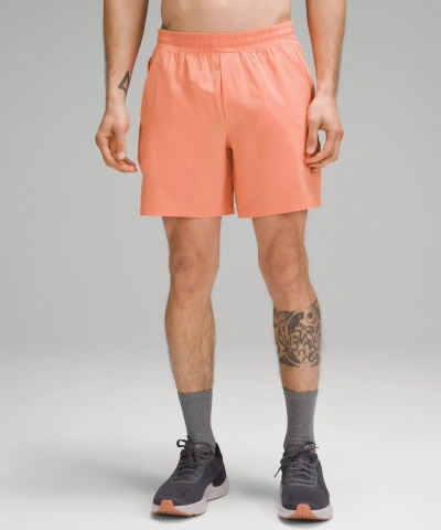 Lululemon Pace Breaker Linerless Shorts 7" In Orange