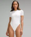 Lululemon Wundermost Bodysuit - Ultra-soft Nulu Short-sleeve Crew Thong Bodysuit In White