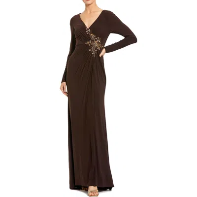 Mac Duggal Faux Wrap Long Sleeve Evening Gown With Appliqué Detail In Brown