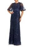 Mac Duggal Flutter Sleeve Floral Emboridered Net Gown In Blue