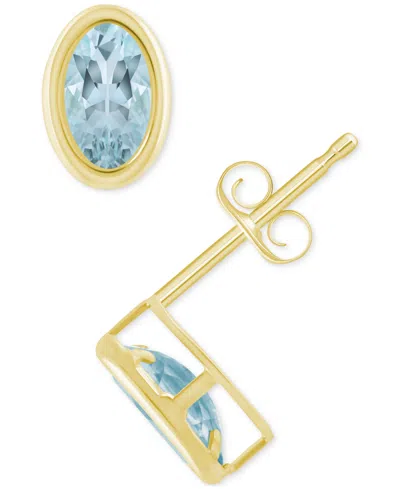 Macy's Created Sapphire Oval Stud Earrings (1-1/2 Ct. T.w.) In 10k Yellow Gold In Aquamarine,gold