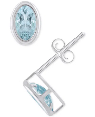 Macy's Created Sapphire Oval Stud Earrings (1-1/2 Ct. T.w.) In 10k Yellow Gold In Aquamarine,white Gold