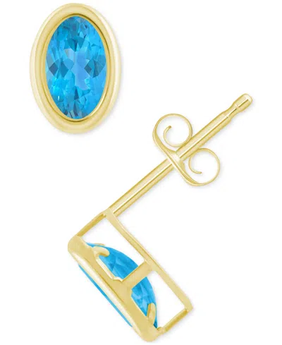Macy's Created Sapphire Oval Stud Earrings (1-1/2 Ct. T.w.) In 10k Yellow Gold In Blue Topaz,gold