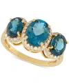 Macy's London Blue Topaz (4 Ct. T.w.) & Diamond (1/4 Ct. T.w.) Oval Trio Halo Ring In 10k Gold In London Blue Topaz